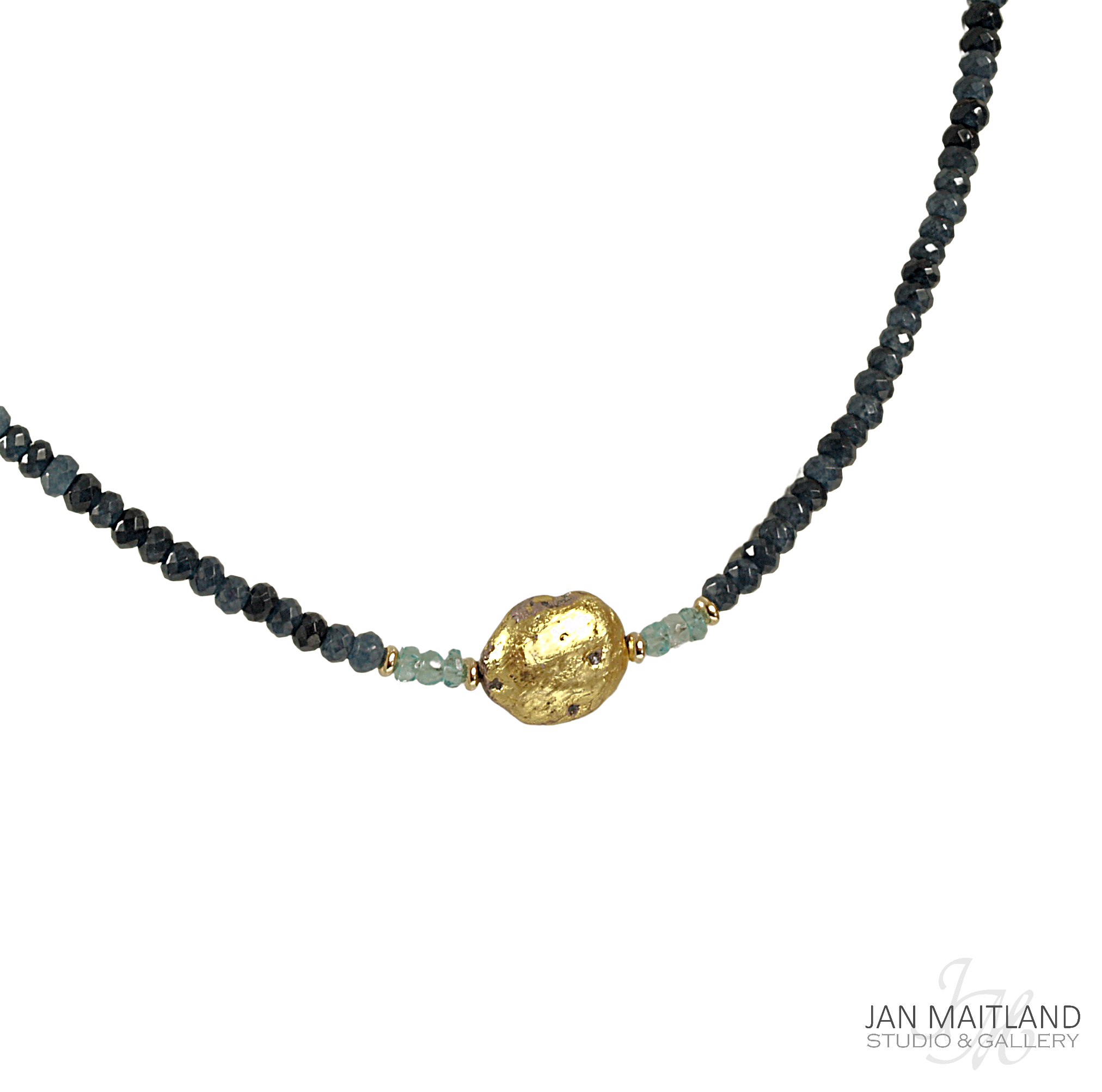 A gold-colored pendant necklace with blue faceted onyx and aqua apatite stones, displayed against a black background.