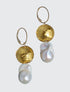 Adorn yourself with the elegance of luxurious white baroque pearls, paired with 24 Karat gold foil and lamp work Venetian glass bead. The pearls boast a gorgeous luster with the compliment of the gold dome shaped gold in the design. The dangle earrings measure 2.25" in length, They make a statement, are fun to wear, and can be worn with dressy or casual wear.