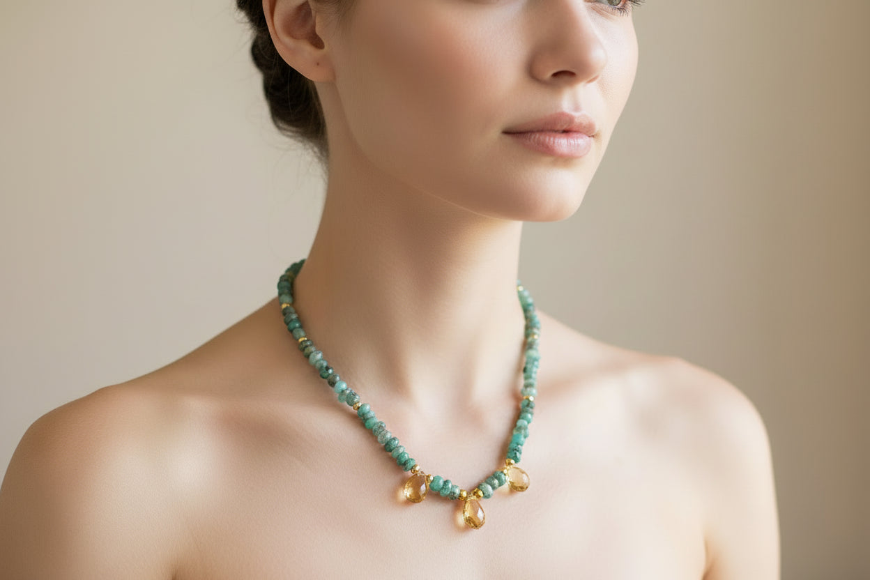 Green and gold necklace on a model.