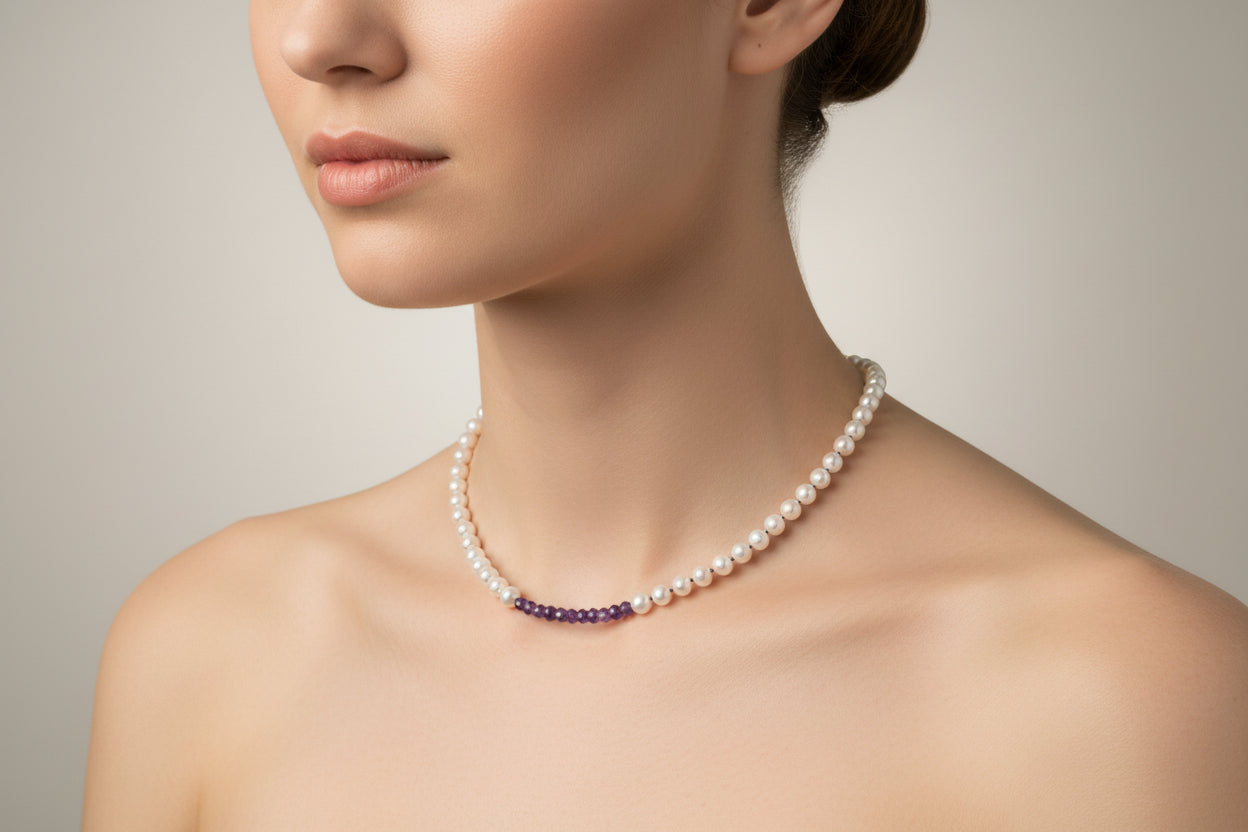 Pearl necklace with purple beads on a model.