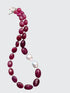 Ruby and Baroque Pearl Necklace - "Romancing the Ruby" necklace. This exquisite piece features cabochon smooth rubies, lustrous Baroque pearls, sterling silver beads, a charming toggle clasp, and a signature tag by the artist. With a length of 18 inches.