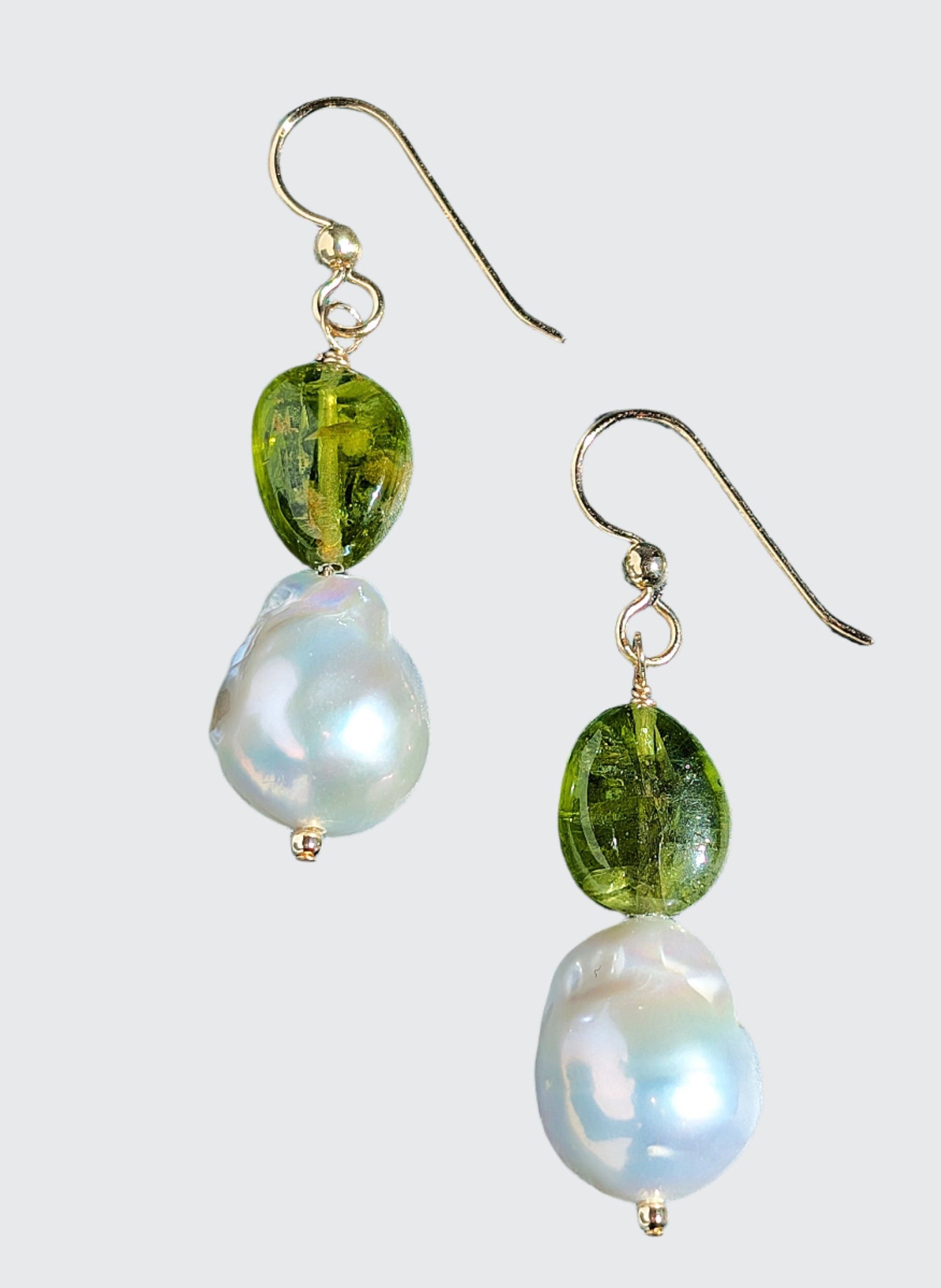 Peridot and Baroque Pearl earrings on 14 Karat gold earring wire. The dangle earrings measure 2".