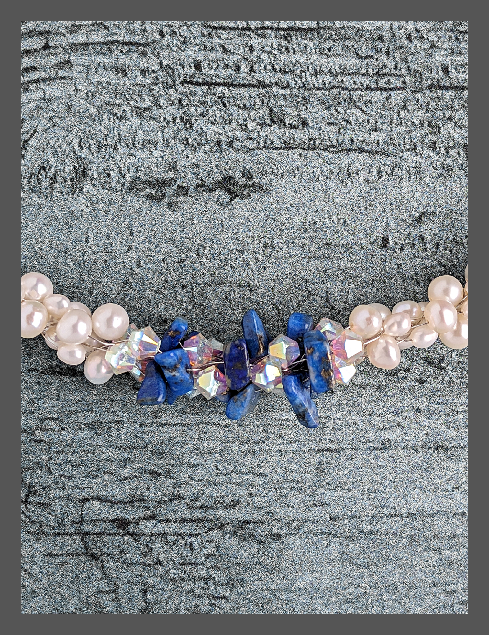 "Something Blue" necklace is a combination of glowing cultured freshwater pearls with center stones in gorgeous lapis lazuli and sparkly Swarovski crystals. The beads are braided on 8 strands to create an elegant heirloom-quality necklace