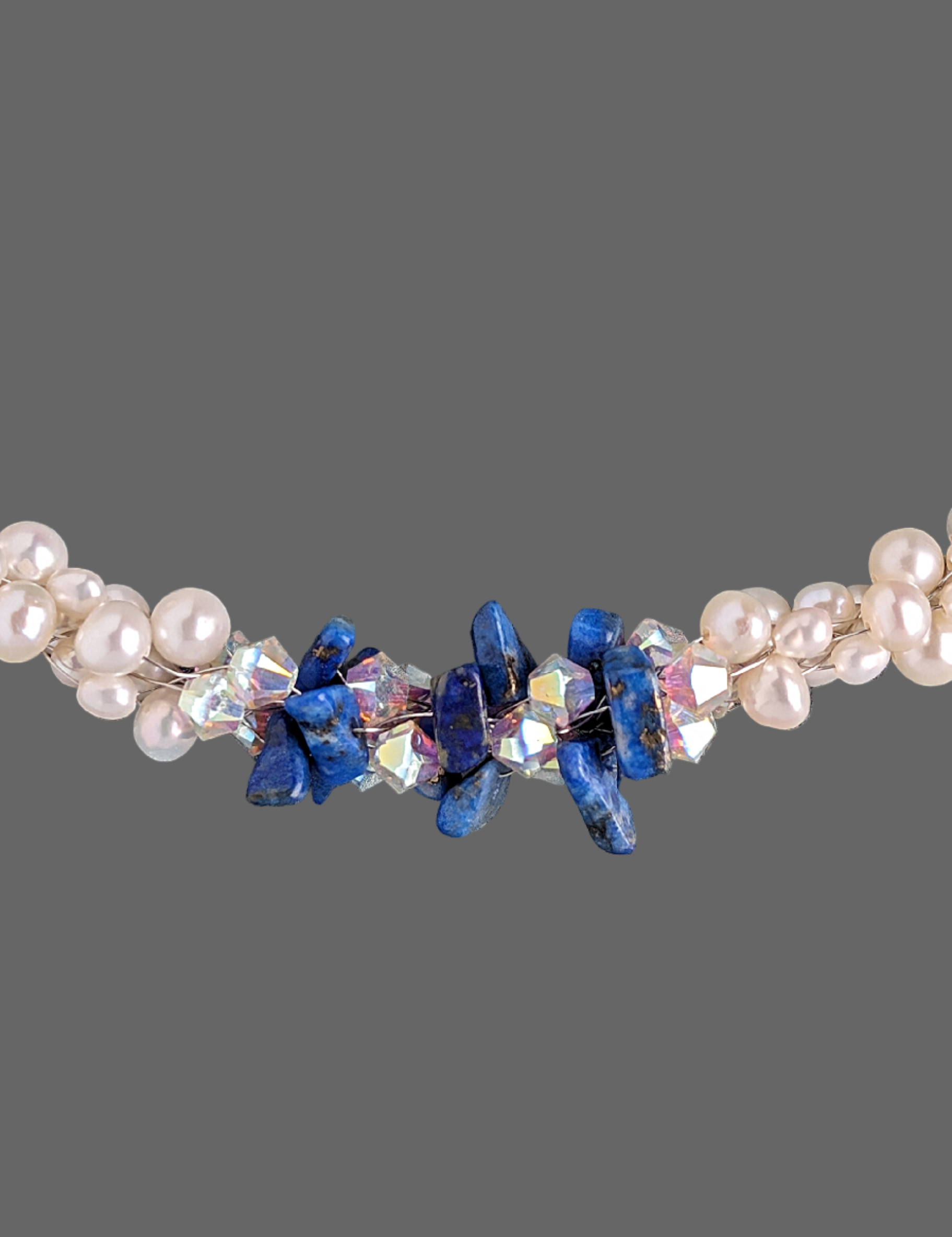 "Something Blue" necklace is a combination of glowing cultured freshwater pearls with center stones in gorgeous lapis lazuli and sparkly Swarovski crystals. The beads are braided on 8 strands to create an elegant heirloom-quality necklace