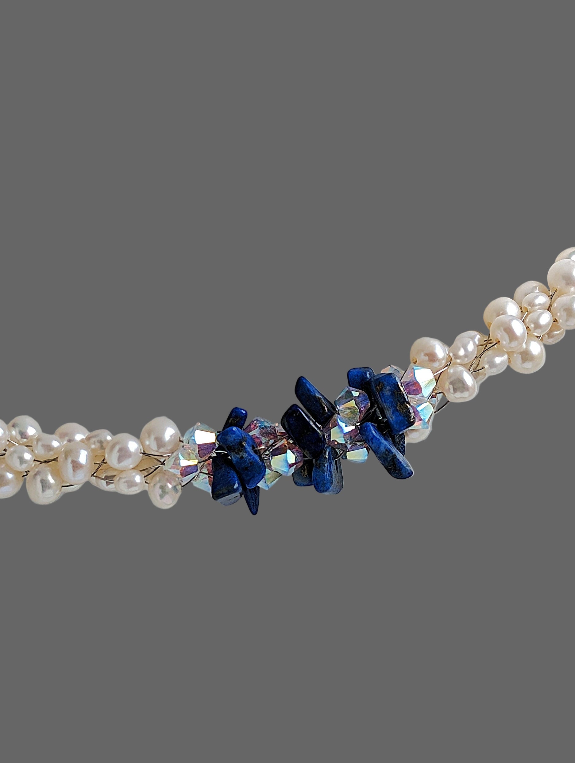 "Something Blue" necklace is a combination of glowing cultured freshwater pearls with center stones in gorgeous lapis lazuli and sparkly Swarovski crystals. The beads are braided on 8 strands to create an elegant heirloom-quality necklace