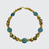 A necklace with blue lampwork Czech glass beads, gold mesh beads, and 23-Karat gold leaf on lava stone, finished with a 14-Karat gold-filled toggle clasp.