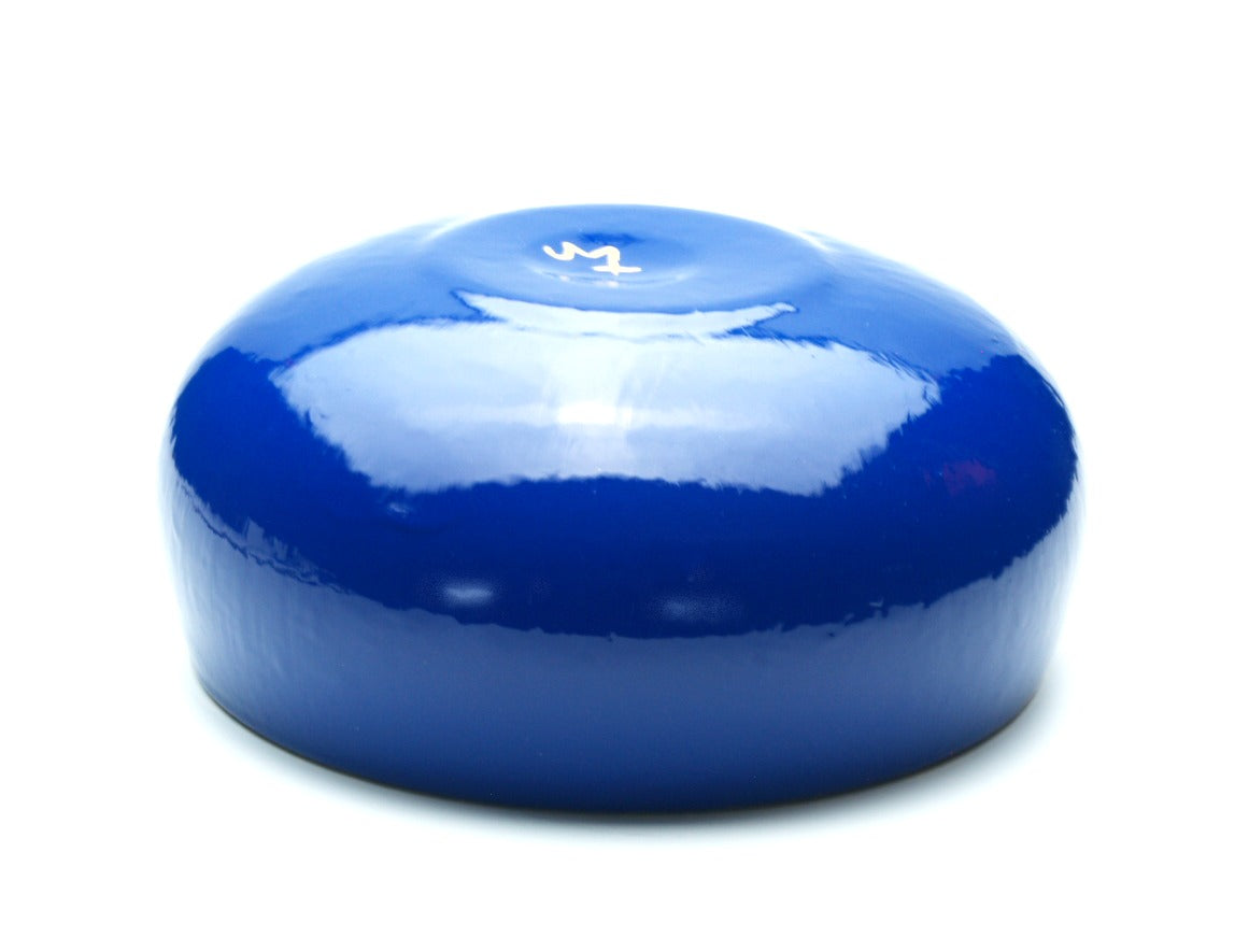 view of Blue and gold gilded glass art bowl with aqua color in the design upside down