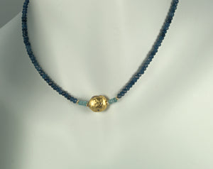 4mm sparkly faceted dark blue onyx, faceted aqua apatite, and gold gilded lava stone Necklace on mannequin neck
