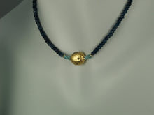 Load image into Gallery viewer, 4mm sparkly faceted dark blue onyx, faceted aqua apatite, and gold gilded lava stone Necklace close up on mannequin neck