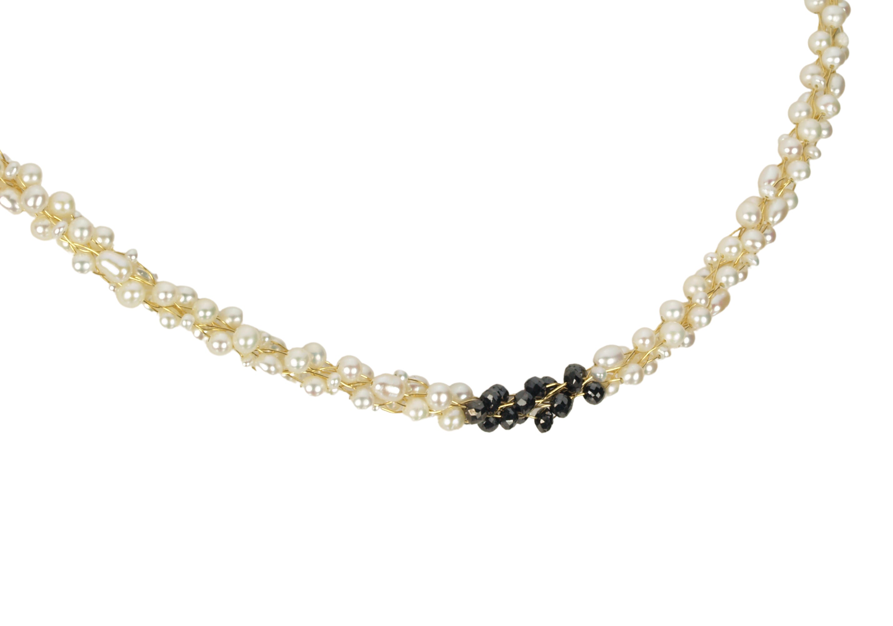 Champagne and Caviar Black Diamond and Pearl Necklace - The combination of black diamonds and white pearls creates a striking contrast. The use of the Japanese Kumihimo technique to braid the beads on eight strands demonstrates the attention to detail and craftsmanship involved in creating this piece. The necklace measures 18"