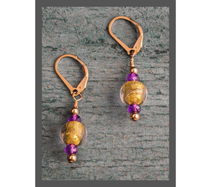Introducing our stunning "Amethyst Allure" earrings, embellished with exquisite lamp work gold glass beads, faceted sparkly amethysts, and finished with 14 Karat gold-filled lever back earring wires. They measure 1.5"