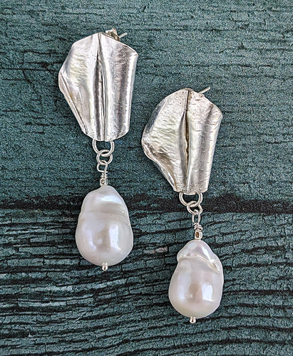 White Baroque pearl drop earrings with sterling silver fold form and hand hammered leaf design.