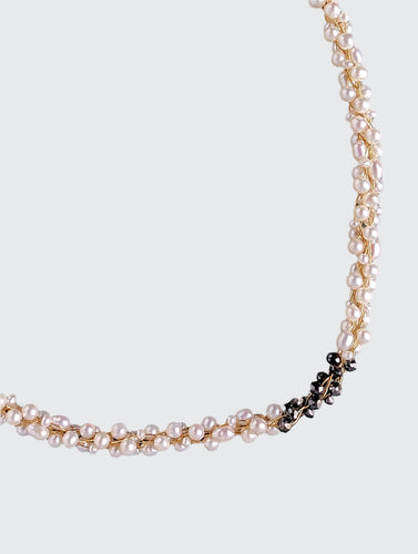 Champagne and Caviar Black Diamond and Pearl Necklace -  The combination of black diamonds and white pearls creates a striking contrast. The use of the Japanese Kumihimo technique to braid the beads on eight strands demonstrates the attention to detail and craftsmanship involved in creating this piece. The necklace measures 18