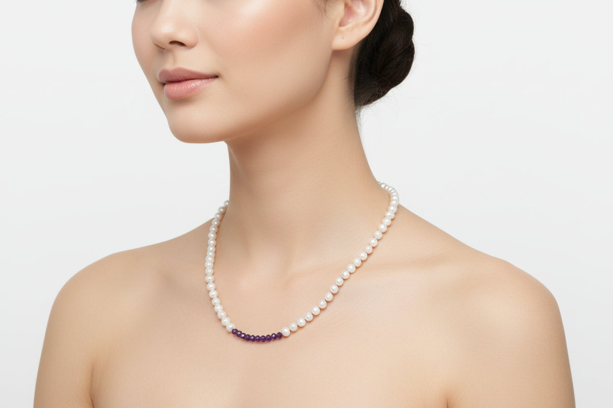 Pearl necklace with purple amethyst beads on a model.