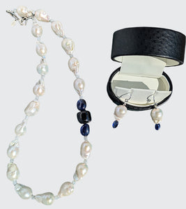 Showing Baroque Pearl and Sapphire Necklace with matching earrings. The necklace is finished with sterling silver heart clasp, earrings are finished with sterling silver French hook earring wire.