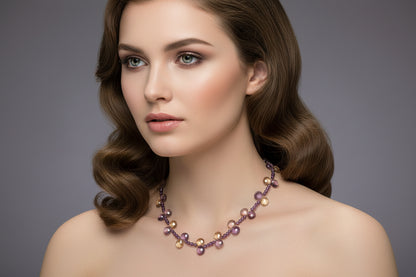 Necklace with purple and gold beads on a model.