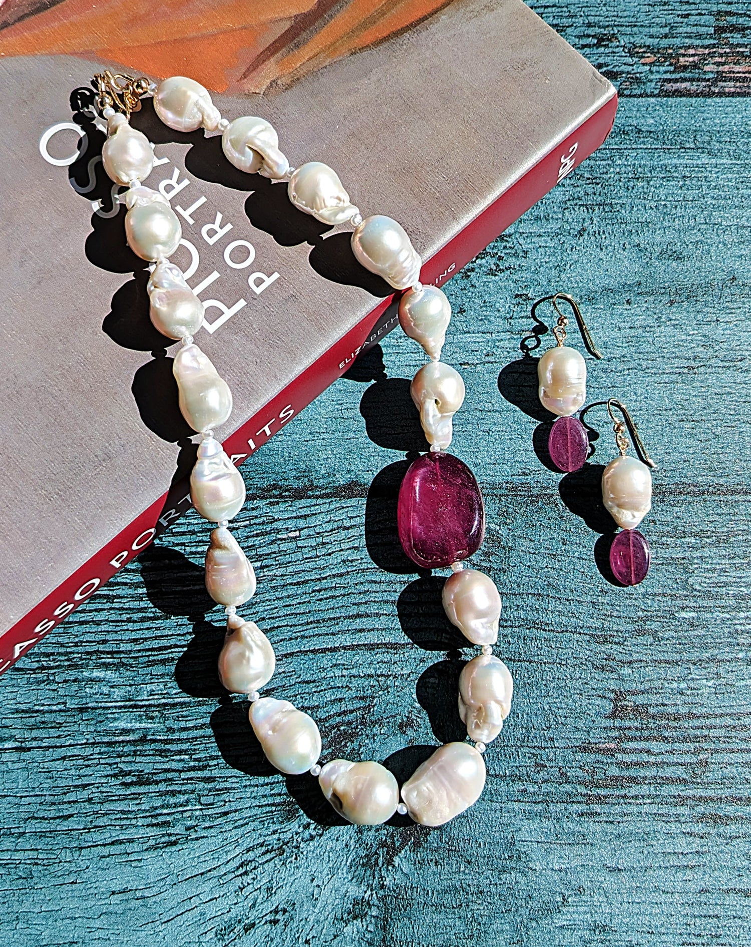 baroque pearl and ruby necklace and earrings.