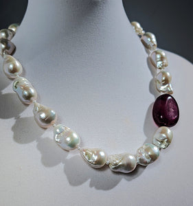 White Baroque Pearl and Ruby Necklace on mannequin neck.