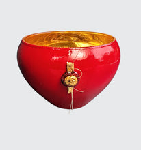 Load image into Gallery viewer, The &quot;Heart Fire&quot; Gilded Gold and Red Glass Bowl is a stunning piece of art crafted using the verre églomisé technique, featuring hand-gilded 23-karat gold leaf and hand-painted red enamel on the backside of the glass. The bowl, measuring 5&quot; x 3&quot;, incorporates gilded gold stone and red lampwork Czech glass, adding unique charm and visual interest. Each piece is one-of-a-kind, showcasing individual artistry in its creation. This bowl serves as an elegant addition to any home décor.