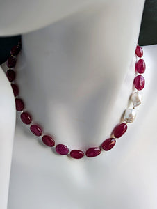 Ruby and Baroque Pearl Necklace on mannequin neck.