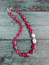 Load image into Gallery viewer, Ruby and Baroque Pearl Necklace - &quot;Romancing the Ruby&quot; necklace. This exquisite piece features cabochon smooth rubies, lustrous Baroque pearls, sterling silver beads, a charming toggle clasp, and a signature tag by the artist. With a length of 18 inches.