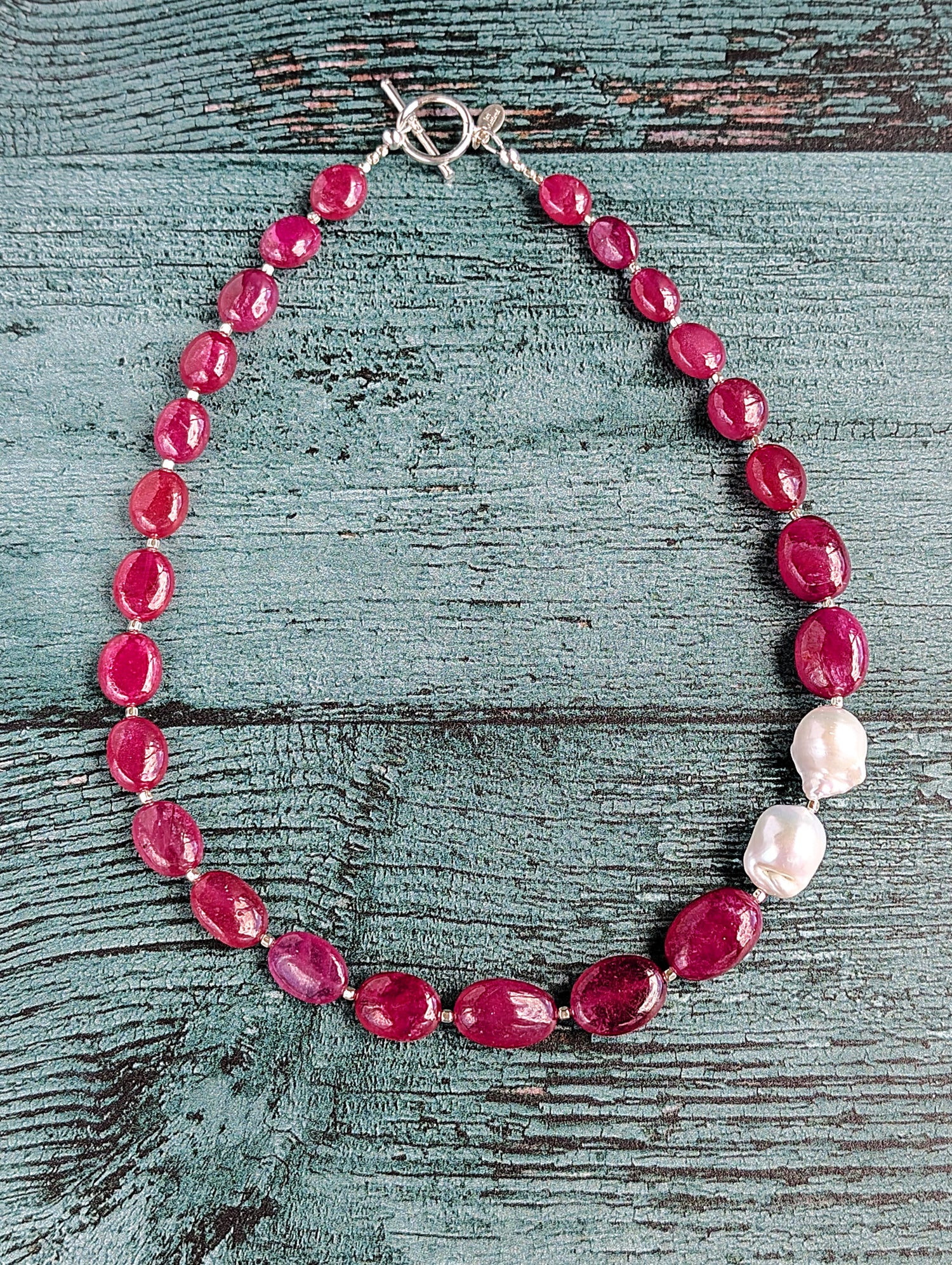 Ruby and Baroque Pearl Necklace - &quot;Romancing the Ruby&quot; necklace. This exquisite piece features cabochon smooth rubies, lustrous Baroque pearls, sterling silver beads, a charming toggle clasp, and a signature tag by the artist. With a length of 18 inches.