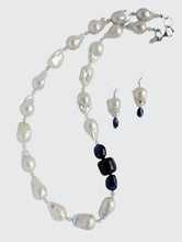 Load image into Gallery viewer, Showing Baroque Pearl and Sapphire Necklace with matching earrings. The necklace is finished with sterling silver heart clasp, earrings are finished with sterling silver French hook earring wire.