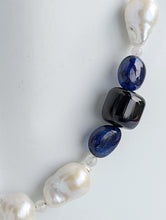 Load image into Gallery viewer, A close-up of the three smooth blue sapphires on the necklace.