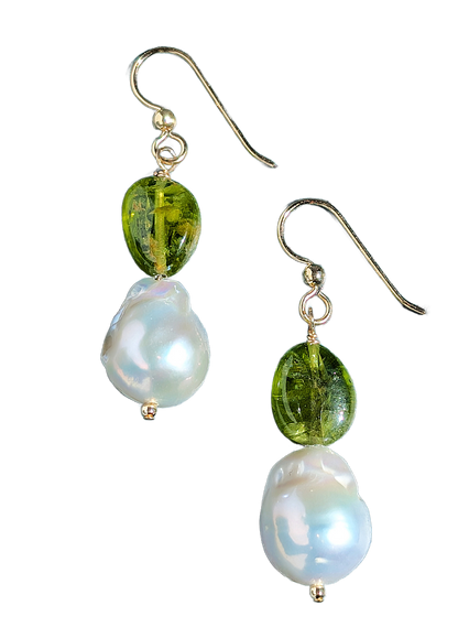 Pair of earrings with green beads and white pearls on a white background