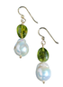 Pair of earrings with green beads and white pearls on a white background
