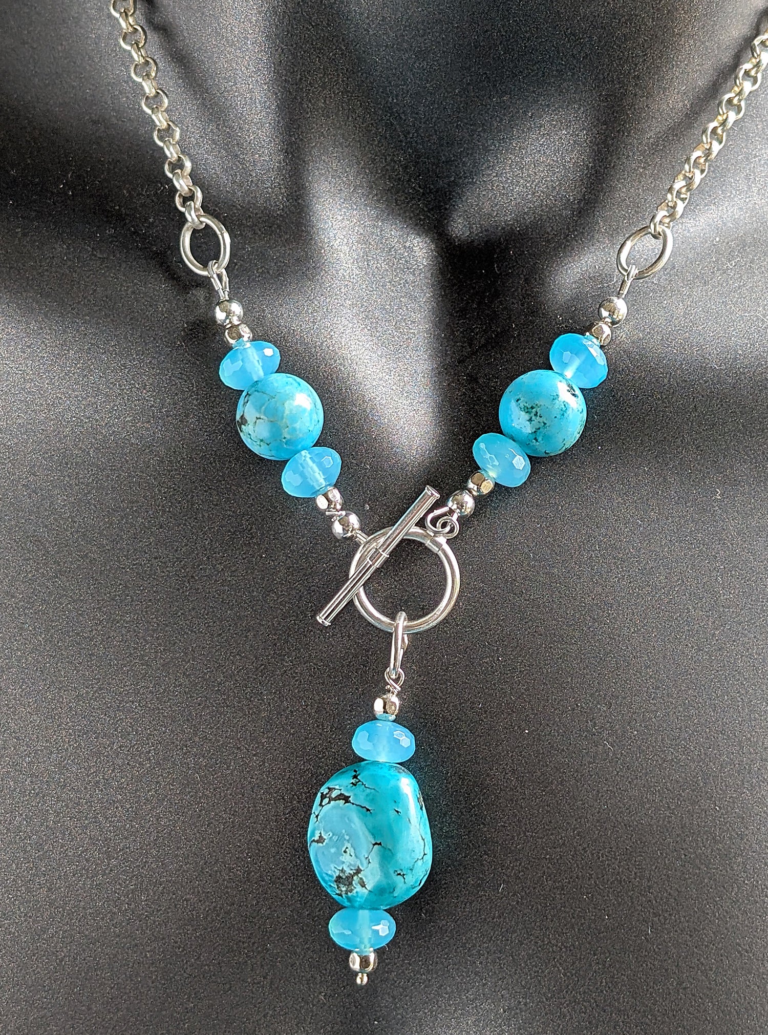 Necklace with turquoise beads on a dark background