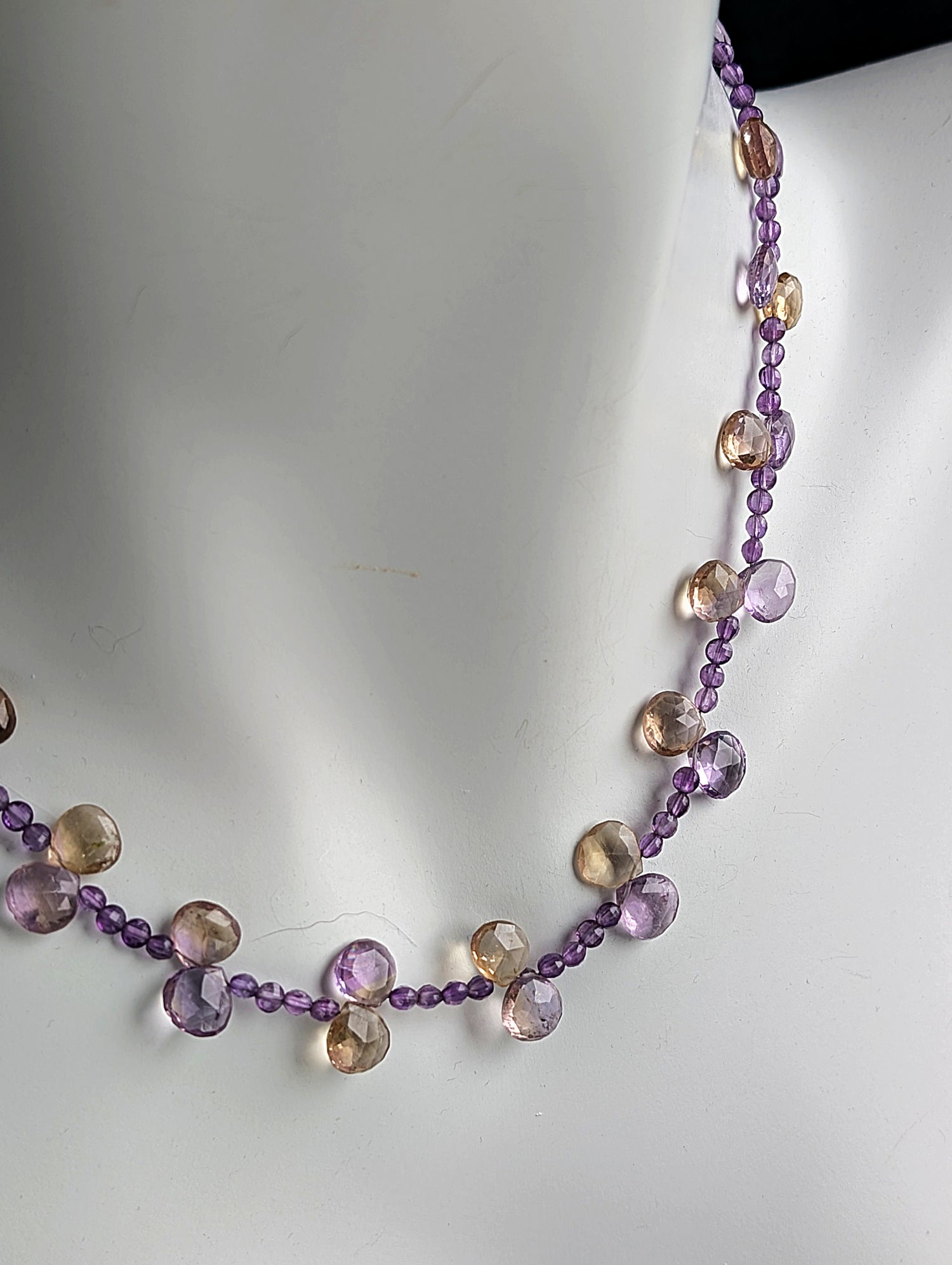 Necklace with multicolored beads on a white background