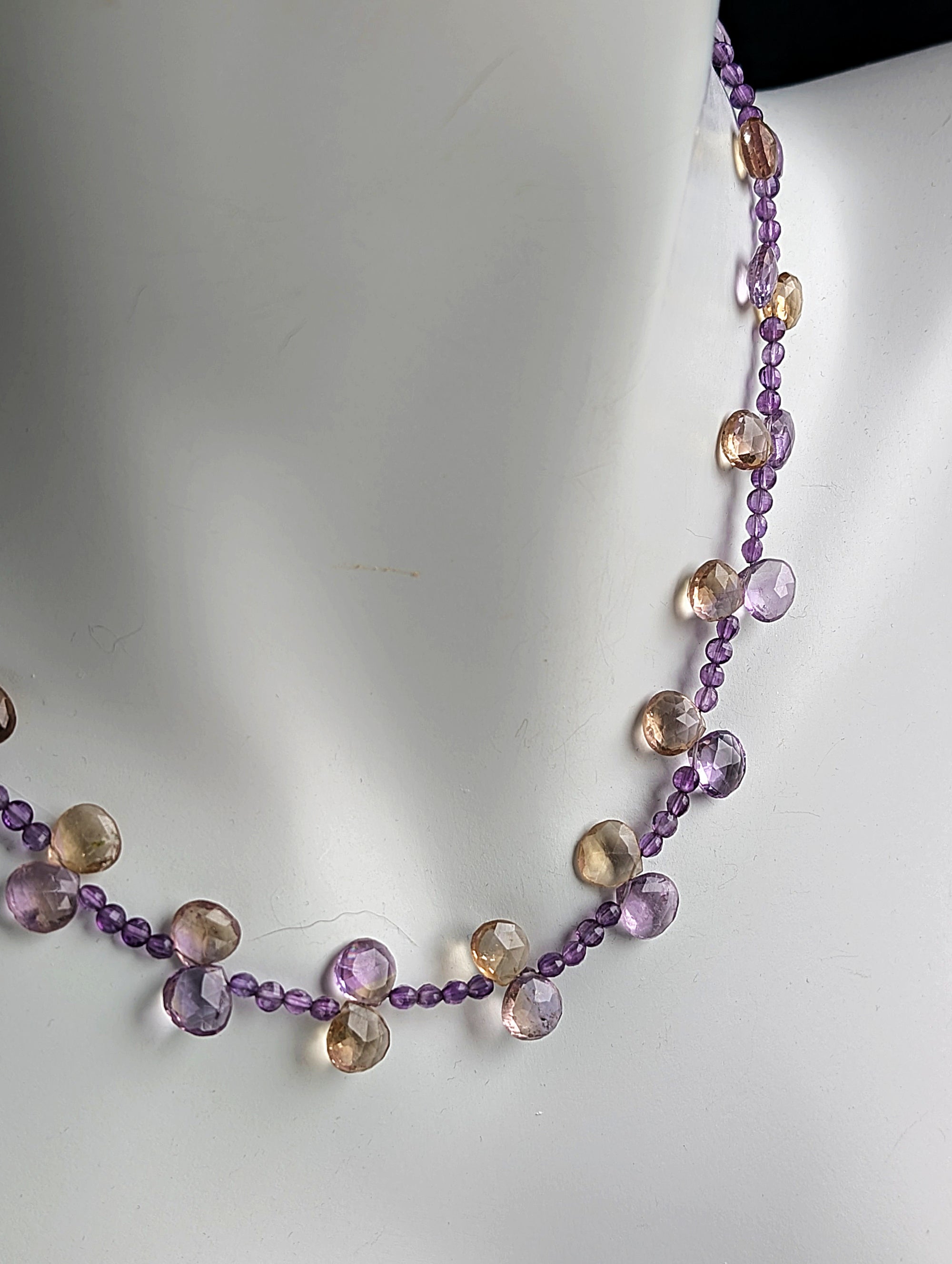 Necklace with multicolored beads on a white background