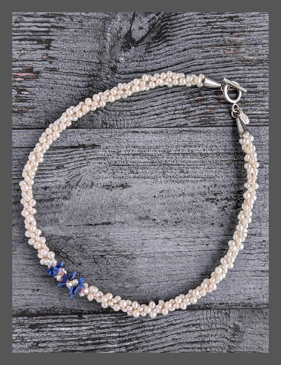 &quot;Something Blue&quot; necklace is a combination of glowing cultured freshwater pearls with center stones in gorgeous lapis lazuli and sparkly Swarovski crystals. The beads are braided on 8 strands to create an elegant heirloom-quality necklace 