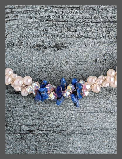 &quot;Something Blue&quot; necklace is a combination of glowing cultured freshwater pearls with center stones in gorgeous lapis lazuli and sparkly Swarovski crystals. The beads are braided on 8 strands to create an elegant heirloom-quality necklace 