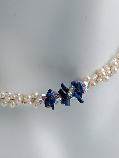 &quot;Something Blue&quot; necklace is a combination of glowing cultured freshwater pearls with center stones in gorgeous lapis lazuli and sparkly Swarovski crystals. The beads are braided on 8 strands to create an elegant heirloom-quality necklace 