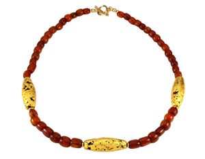Necklace with three gold gilded oblong lava beads evenly spaced between pecan colored amber beads laid out in a circle with closed toggle clasp.