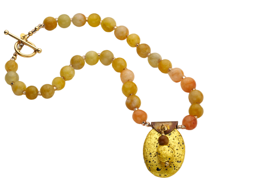 gold gilded on lava pendant and yellow jade necklace