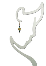 Load image into Gallery viewer, 4mm faceted dark blue onyx, aqua apatite, and 23 karat gold gilded round lava stone with 14-karat gf leverback earrings on a small outline mannequin.