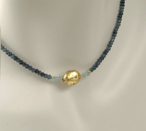 4mm sparkly faceted dark blue onyx, faceted aqua apatite, and gold gilded lava stone Necklace close up on mannequin neck