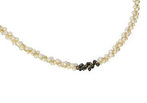 Champagne and Caviar Black Diamond and Pearl Necklace - The combination of black diamonds and white pearls creates a striking contrast. The use of the Japanese Kumihimo technique to braid the beads on eight strands demonstrates the attention to detail and craftsmanship involved in creating this piece. The necklace measures 18" 