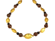Load image into Gallery viewer, Hand made necklace with 23 karat gold gilded lava stones, lamp work bronze Czech glass, and 14 karat gold filled small round beads.