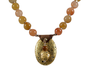 gold gilded on lava pendant and yellow jade necklace