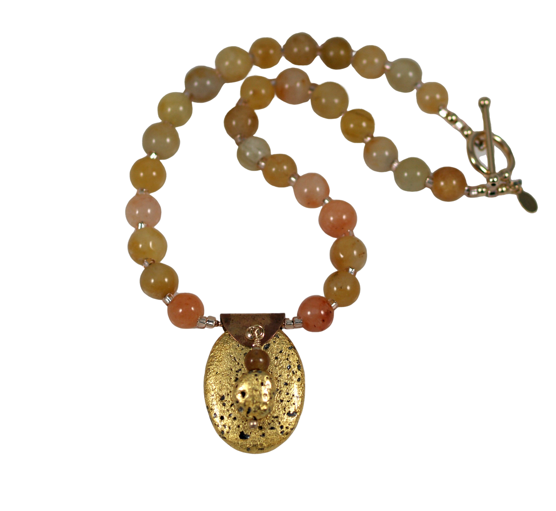 gold gilded on lava pendant and yellow jade necklace