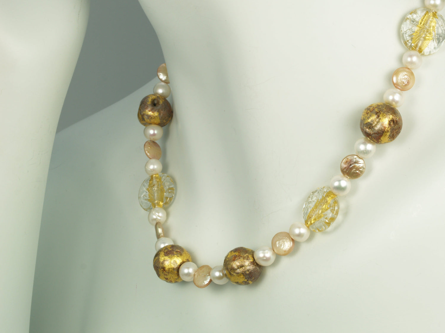 Pearl necklace with gold gilded beads, gold lampwork Czech glass beads, featured on a mannequin neck