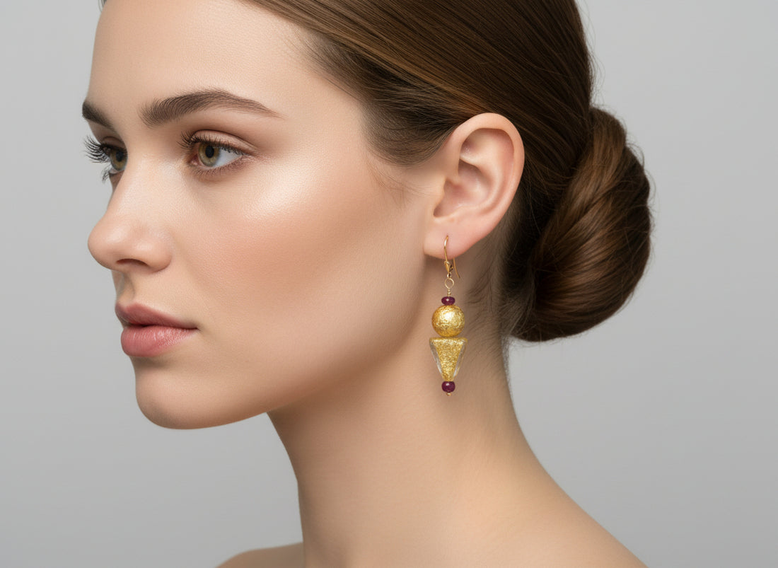 Gold and ruby earrings on model