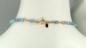 aquamarine and gold gilded round lava pendant necklace back toggle clasp