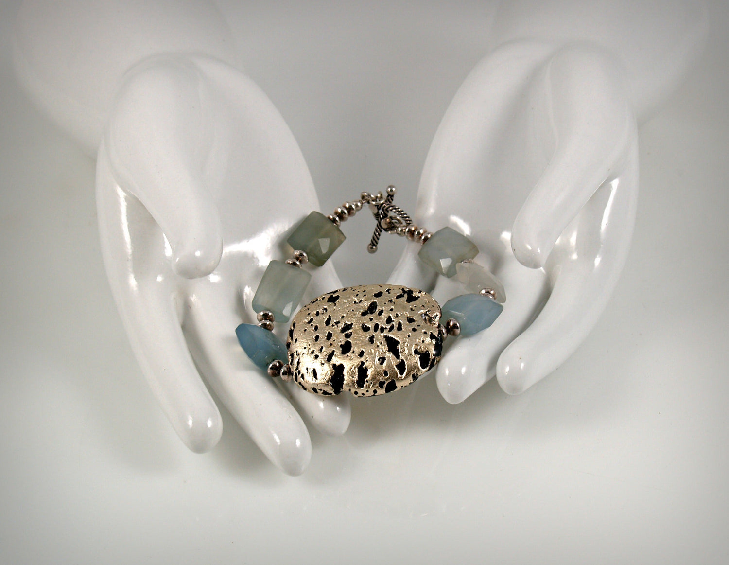 Baby Blue Glow Bracelet in Chalcedony and White Gold Gilded Leaf On Lava Stone
