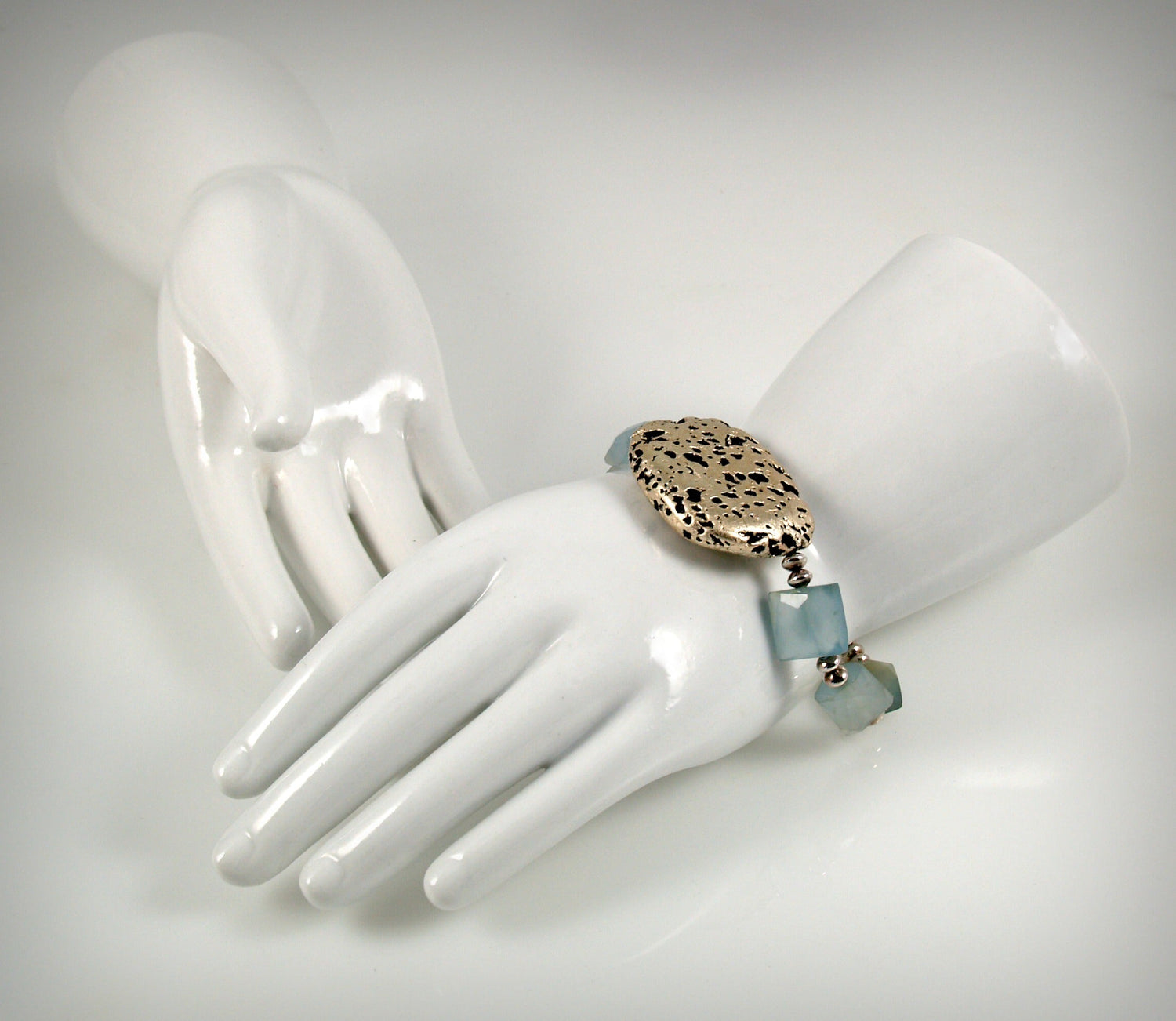 Baby Blue Glow Bracelet in Chalcedony and White Gold Gilded Leaf On Lava Stone