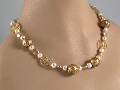 Pearl necklace with gold gilded beads, gold lampwork Czech glass beads, featured on a mannequin neck